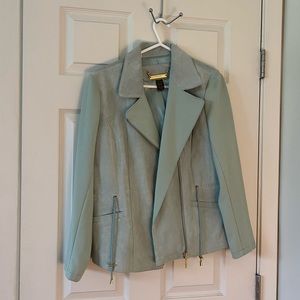 Seafoam green leather jacket with gold accents.By Iman